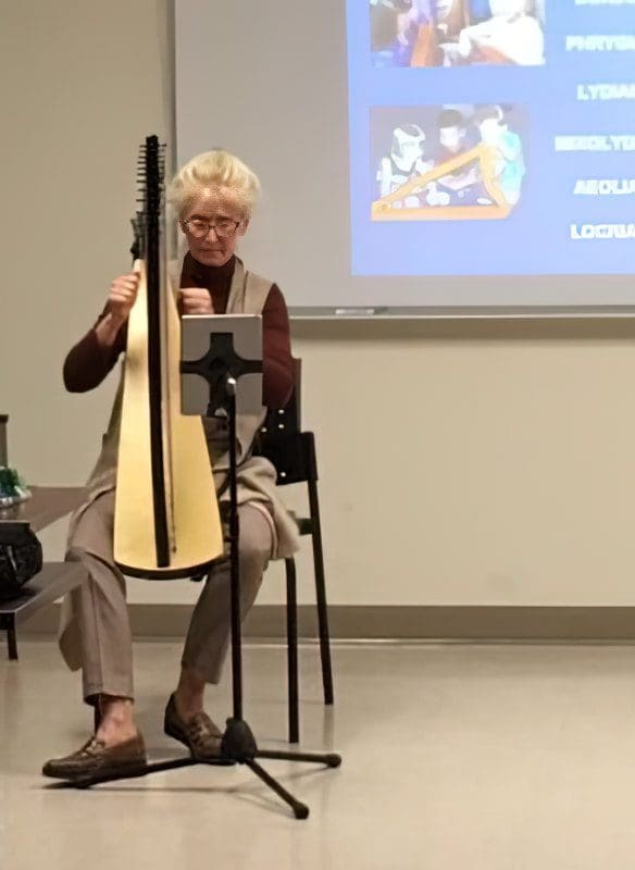 Martha teaching harp