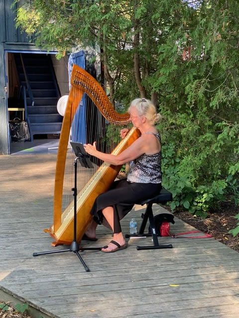 Martha Lawrance playing the harp